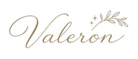 The word 'Valeron' is written in elegant gold cursive script with a small leafy branch and star accent above it, on a plain light background.